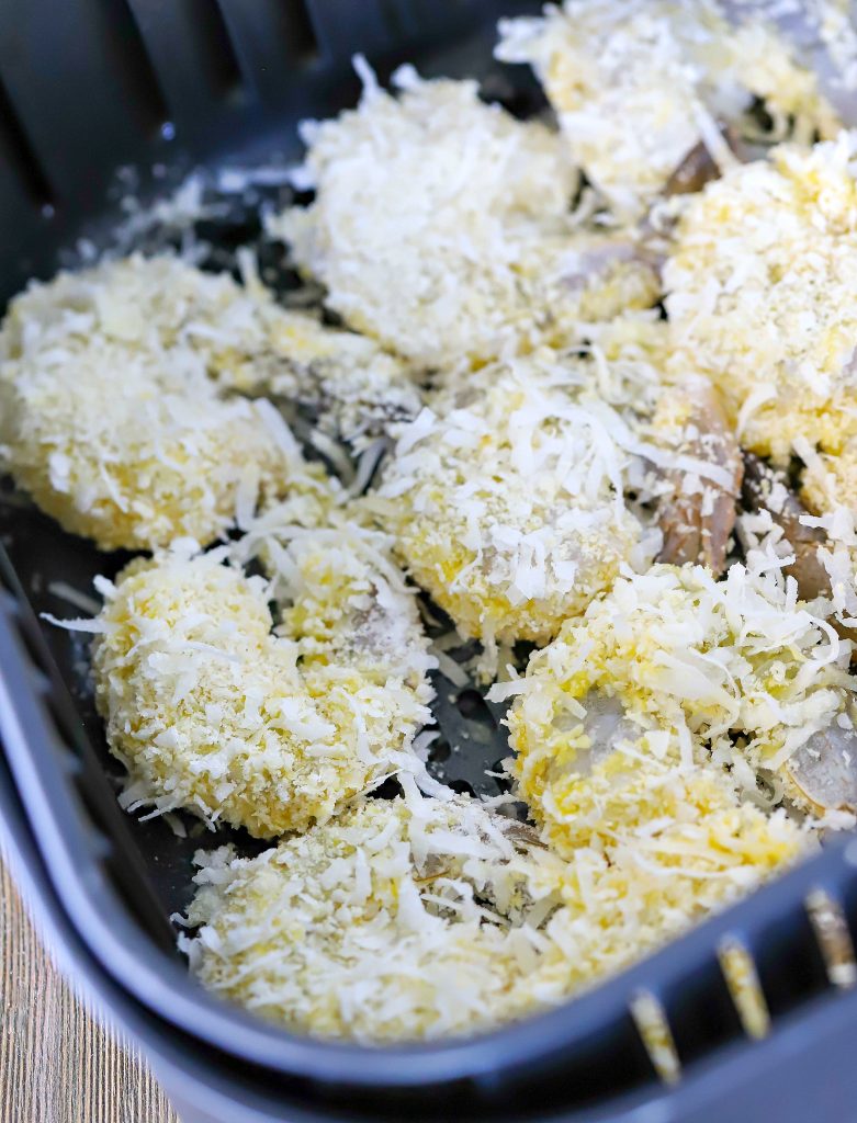 Air Fryer filled with coconut shrimp that are about to be cooked.