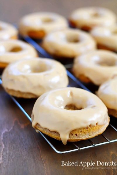 These Baked Apple Donuts with Maple Glaze are seriously the best baked donuts ever! Moist, apple-spiced flavor dipped in the tastiest maple glaze known to man. And only 196 calories per donut!