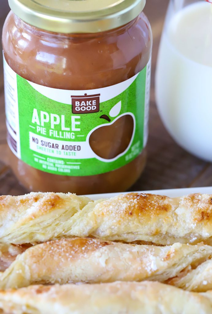Apple Pie Filling behind a plate of apple pastries.