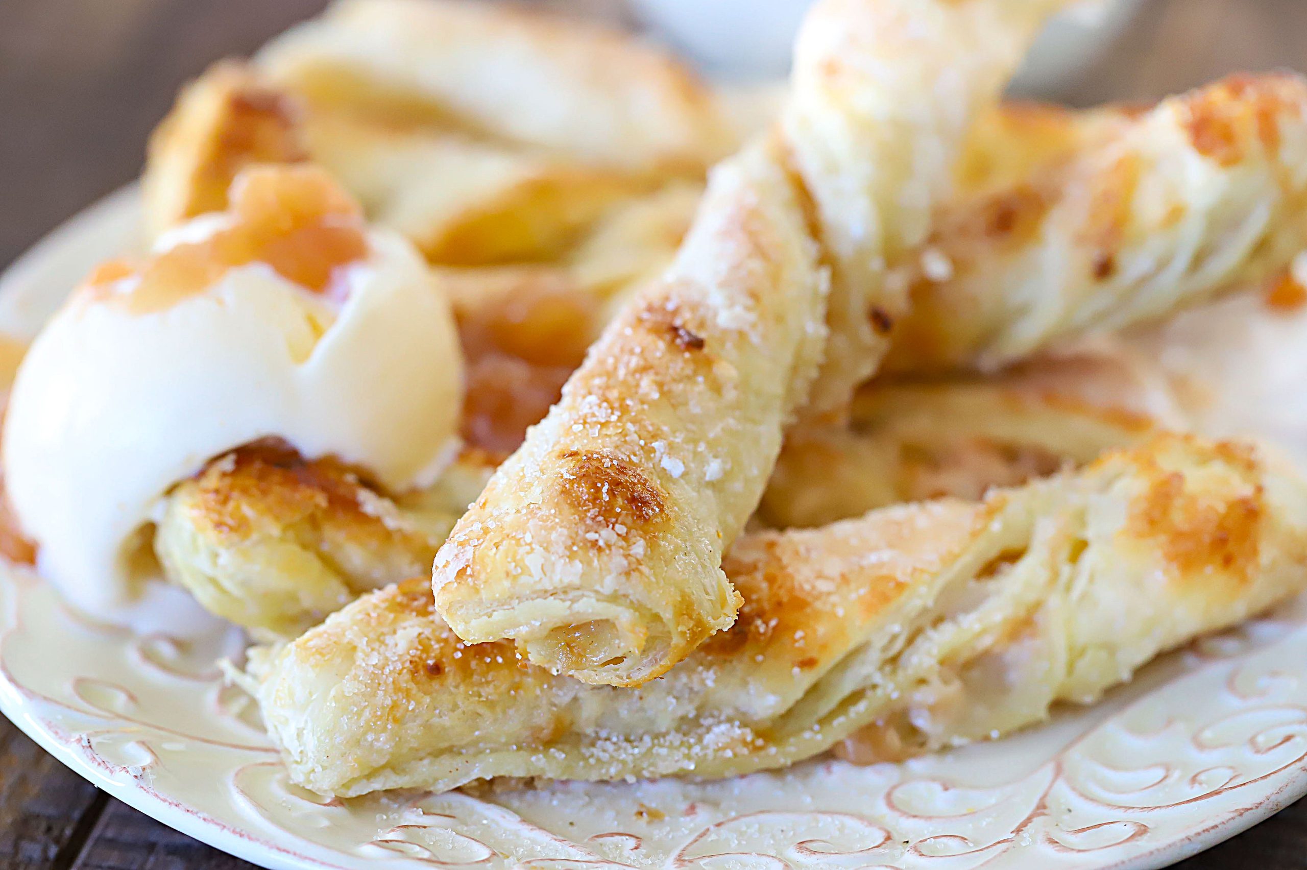 Apple Strudel Twists with a side of vanilla cream.
