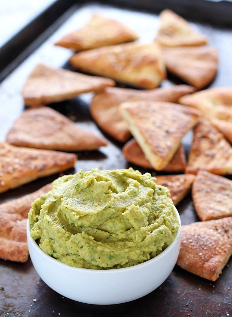 Avocado Hummus with Homemade Pita Chips - you will go crazy for the combo of avocado, garbanzo beans and spices! Dip in some easy homemade pita chips, and you have yourself a healthy, flavorful snack!