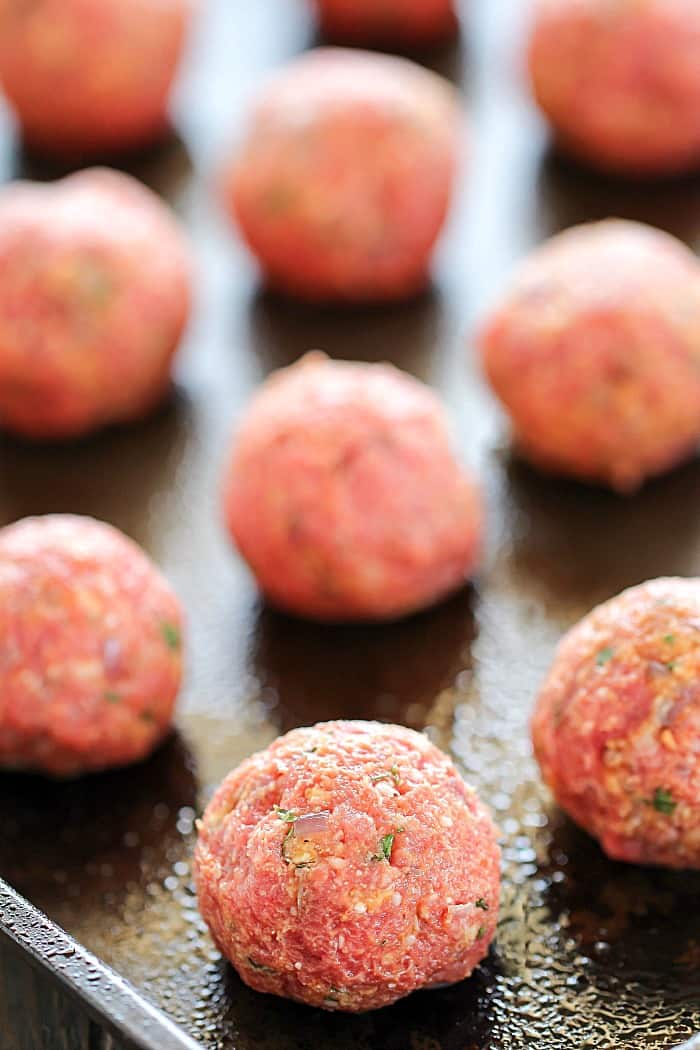 Cookie sheet shot of these delicious Bacon Meatballs before they're sliding into the oven.