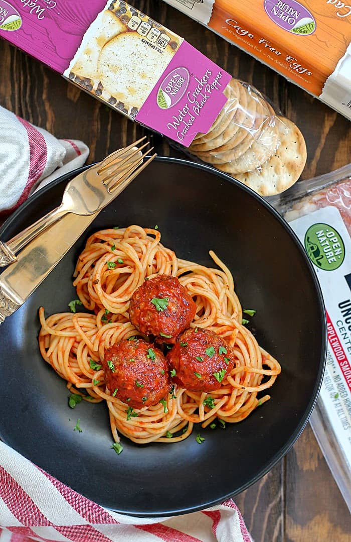 The perfect combination of bacon and beef is Bacon Meatballs! An overview shot of these easy Bacon Meatballs on a bed of pasta.