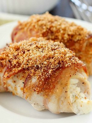 Bacon Wrapped Cream Cheese Chicken Rollups are easy to make and are packed with flavor! Cream cheese and green onions are spread over chicken cutlets and wrapped in bacon and baked then topped with bread crumbs. This is a dish everyone will rave over! Plus 22 more delicious bacon recipes for you to drool over. You're welcome! ;)