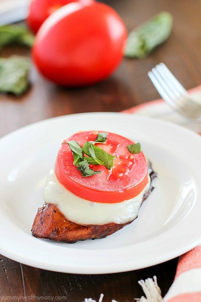 Easy Balsamic Chicken recipe with a caprese twist! Chicken breasts are cooked until tender in a flavorful balsamic sauce then topped with mozzarella, basil & tomato. Low carb and gluten free!