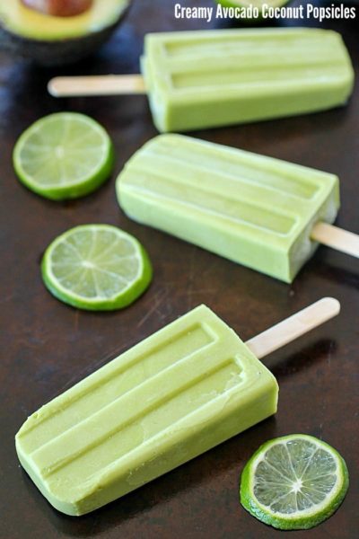 Creamy Avocado Coconut Popsicles - every bite is a tropical getaway! Who would have thought that avocado in a popsicle would be so delicious? You get a little coconut, lime and avocado in every bite of these popsicles! AD