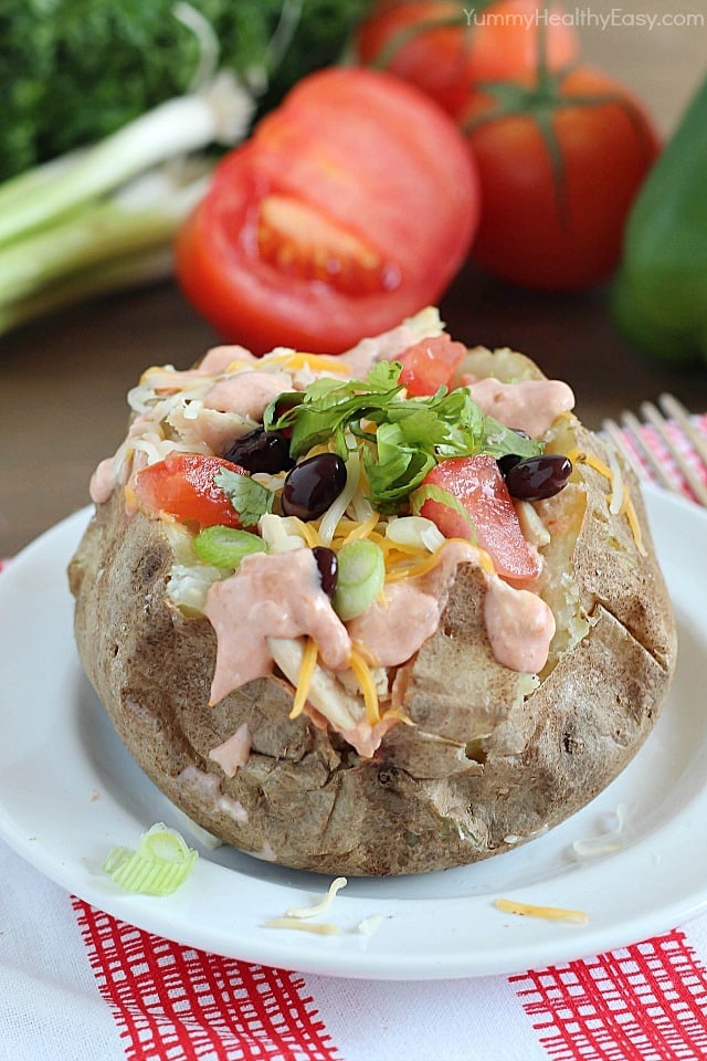 Easy Crock Pot Baked Potatoes served with a creamy salsa and topped with all your favorite taco toppings! Easy Crock Pot Baked Potatoes served with a creamy salsa and topped with all your favorite taco toppings!