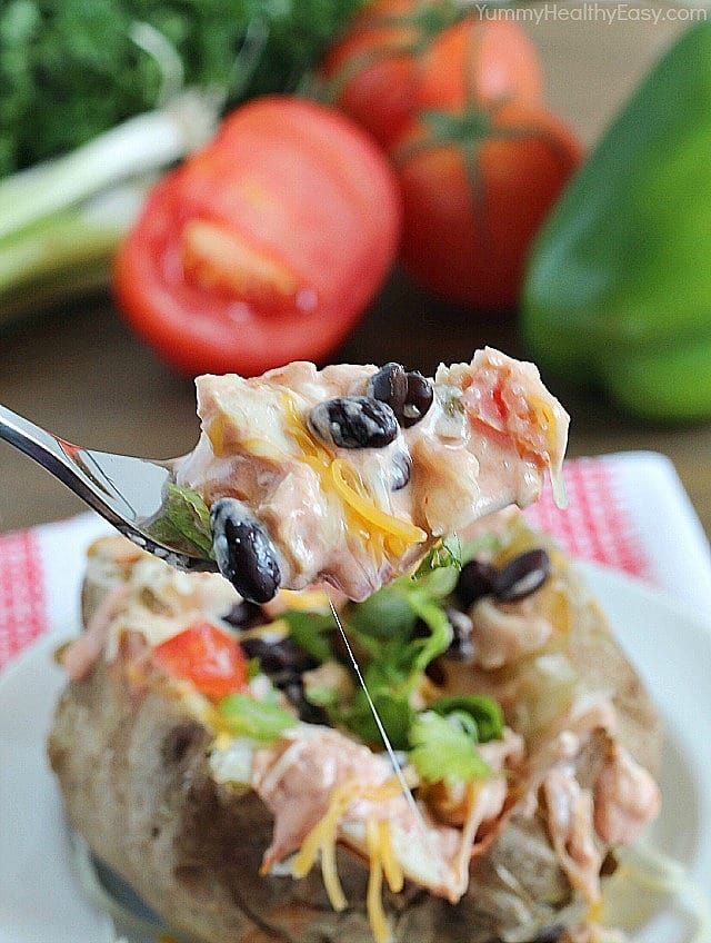Easy Crock Pot Baked Potatoes served with a creamy salsa and topped with all your favorite taco toppings! Easy Crock Pot Baked Potatoes served with a creamy salsa and topped with all your favorite taco toppings!