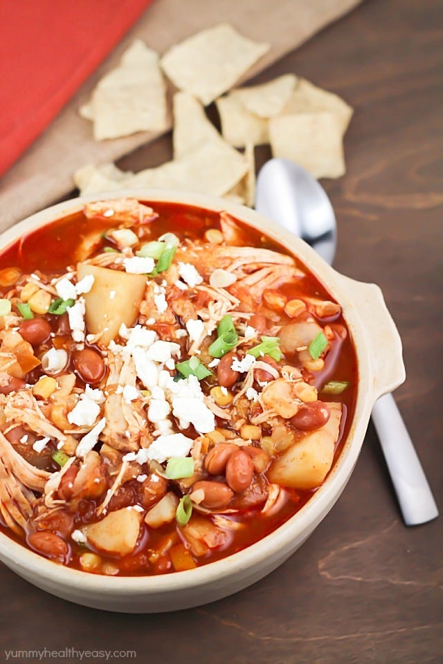 Yummy crock pot chicken chili stew with pinto beans, potatoes, corn, spices and topped with feta cheese. Easy prep and so delicious!