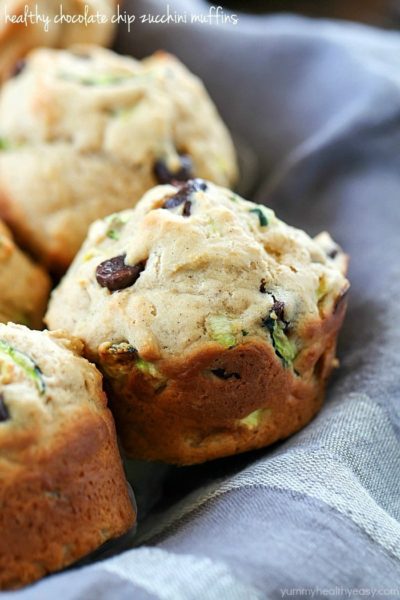 These Chocolate Chip Zucchini Muffins are the best of both worlds - healthy AND decadent! They're full of tender zucchini and chocolate chips but are made healthier by using applesauce instead of lots of butter. These make a yummy breakfast or after school snack!