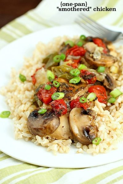 Baked "Smothered Chicken" may sound weird, but this is an incredibly easy and delicious one-pan, baked chicken dinner recipe that my family loves! It's healthy and high in protein and is low-carb & gluten-free without the side of rice. Super easy and no pre-cooking of the meat, just throw it all in the pan and bake! It comes out juicy and flavorful!