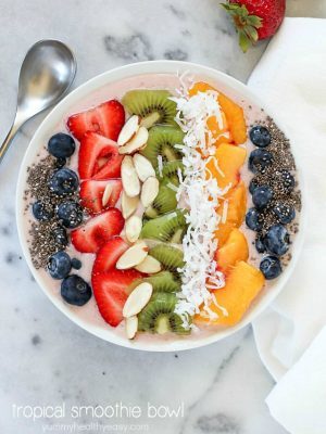 This Tropical Smoothie Bowl Recipe is the perfect breakfast or snack! It's dairy-free, gluten-free, full of protein and fresh fruit and totally delicious. Satisfying and easy to make, too! #SilkCashew #ad