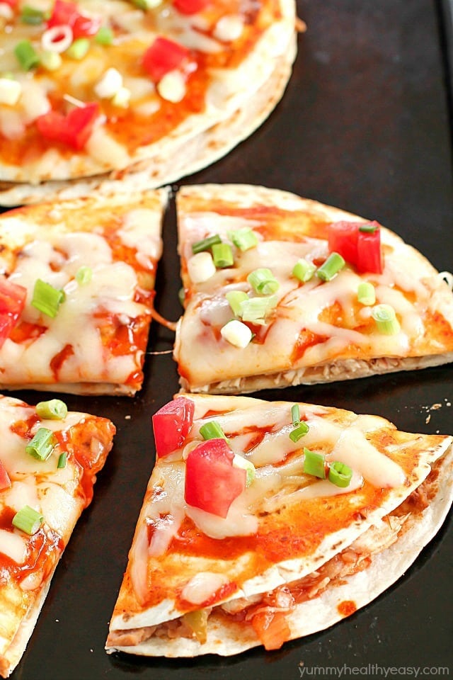 How about Mexican Pizzas for dinner? They're an easy, yummy recipe of layered flour tortillas with a filling of refried beans, shredded chicken and salsa. Top it off with a little enchilada sauce and cheese, bake for a few minutes, and you got yourself an incredible Mexican Pizza for dinner!