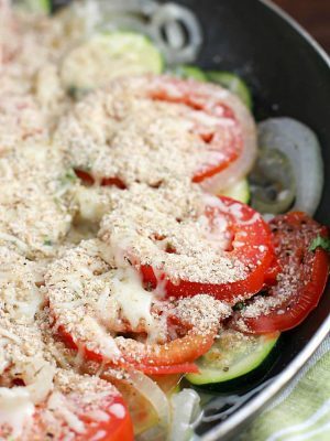 No better way to use up that summer zucchini than in a healthy and easy side dish! This Tomato Zucchini Skillet is made in one pan and kicks the pants off those frozen veggie side dishes!
