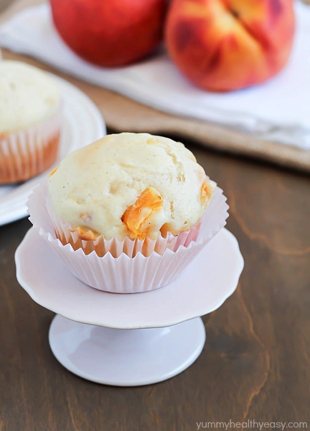 These Peach Muffins are filled with chunks of yummy peach pieces. It's the best breakfast or snack! #breakfast #muffins #peach via @jennikolaus