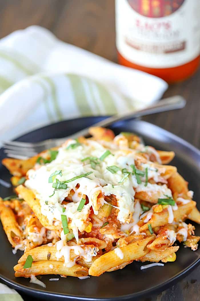 Plate of pasta with Rao's pasta sauce in the background.