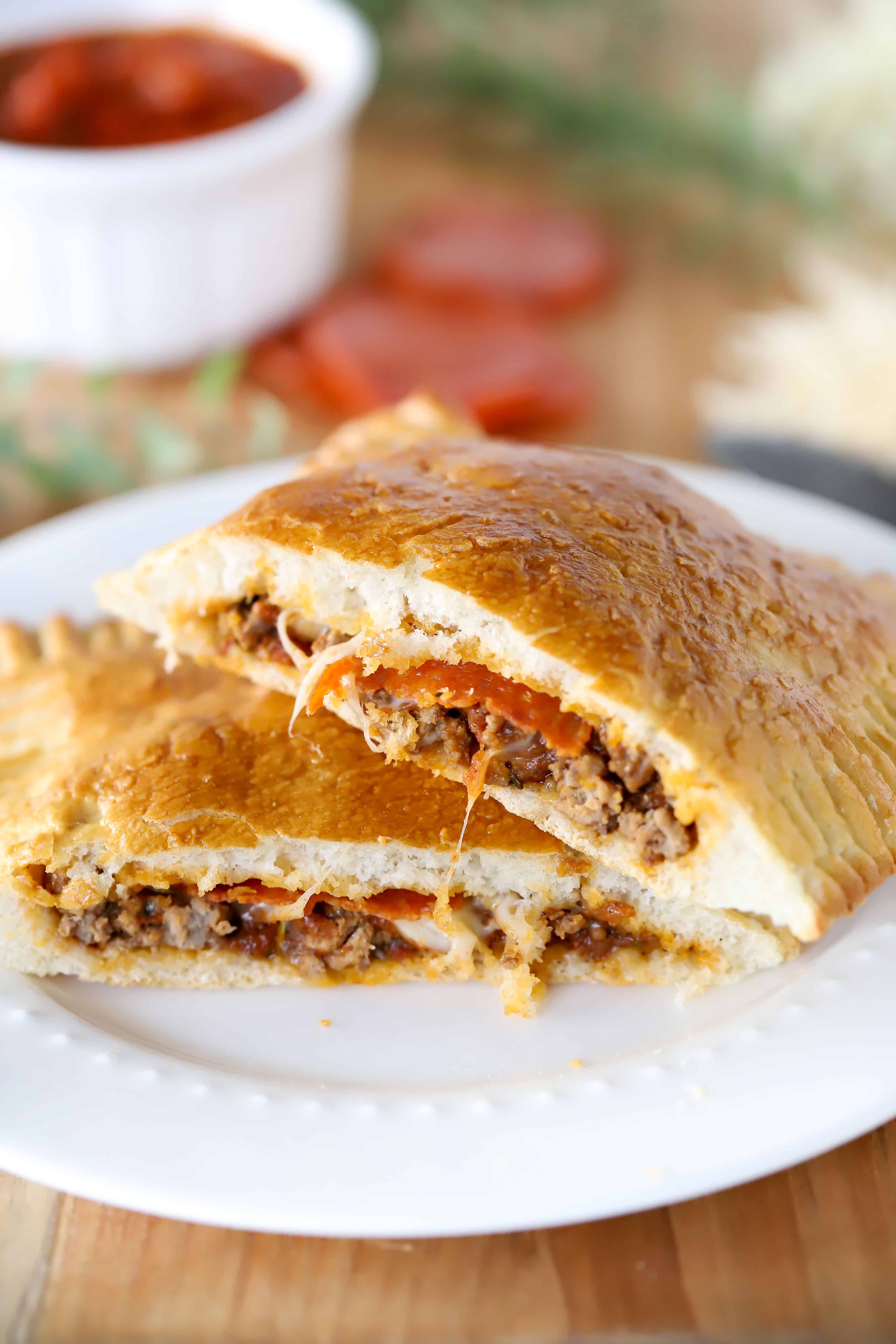 Cut in half pizza pocket on a plate. #ad