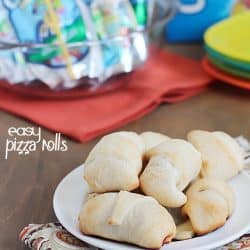 Simple & delicious Pizza Rolls made from ready-made pizza dough, mozzarella sticks, pizza sauce and pepperoni all rolled together in a fun little bite and served with a refreshing Capri Sun! #ad