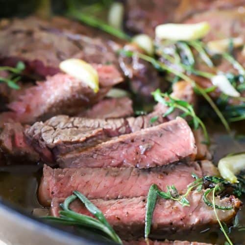 Sliced ribeye in a cast iron skillet