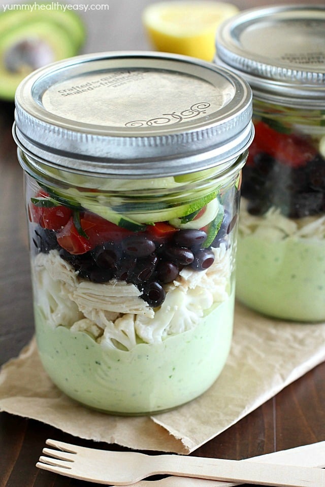 Avocado dressing (southwest style!) is nestled on the bottom of this delicious mason jar salad with zucchini noodles on the top and chicken, veggies and black beans tucked in the middle. A delicious and healthy low-carb, low-sugar lunch prepared ahead of time and eaten on-the-go! Plus a HUGE Blendtec Giveaway you won't want to miss!!