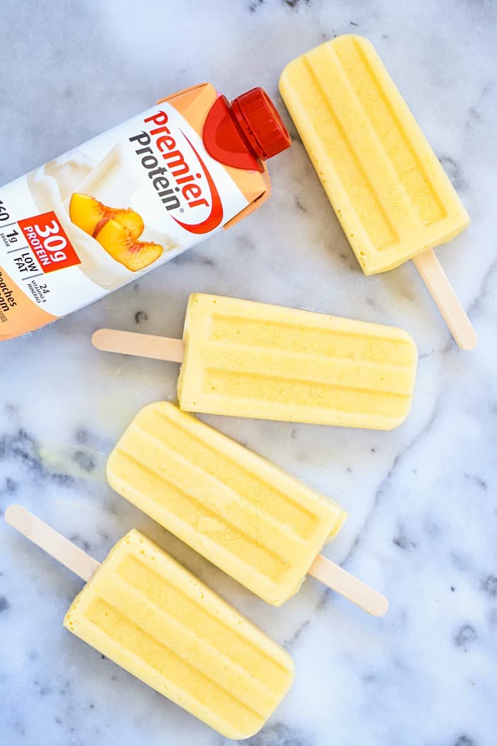 You HAVE to try these Tropical Protein Popsicles Recipe! They're SO good! Only a couple of ingredients for a crazy delicious protein popsicles! #AD